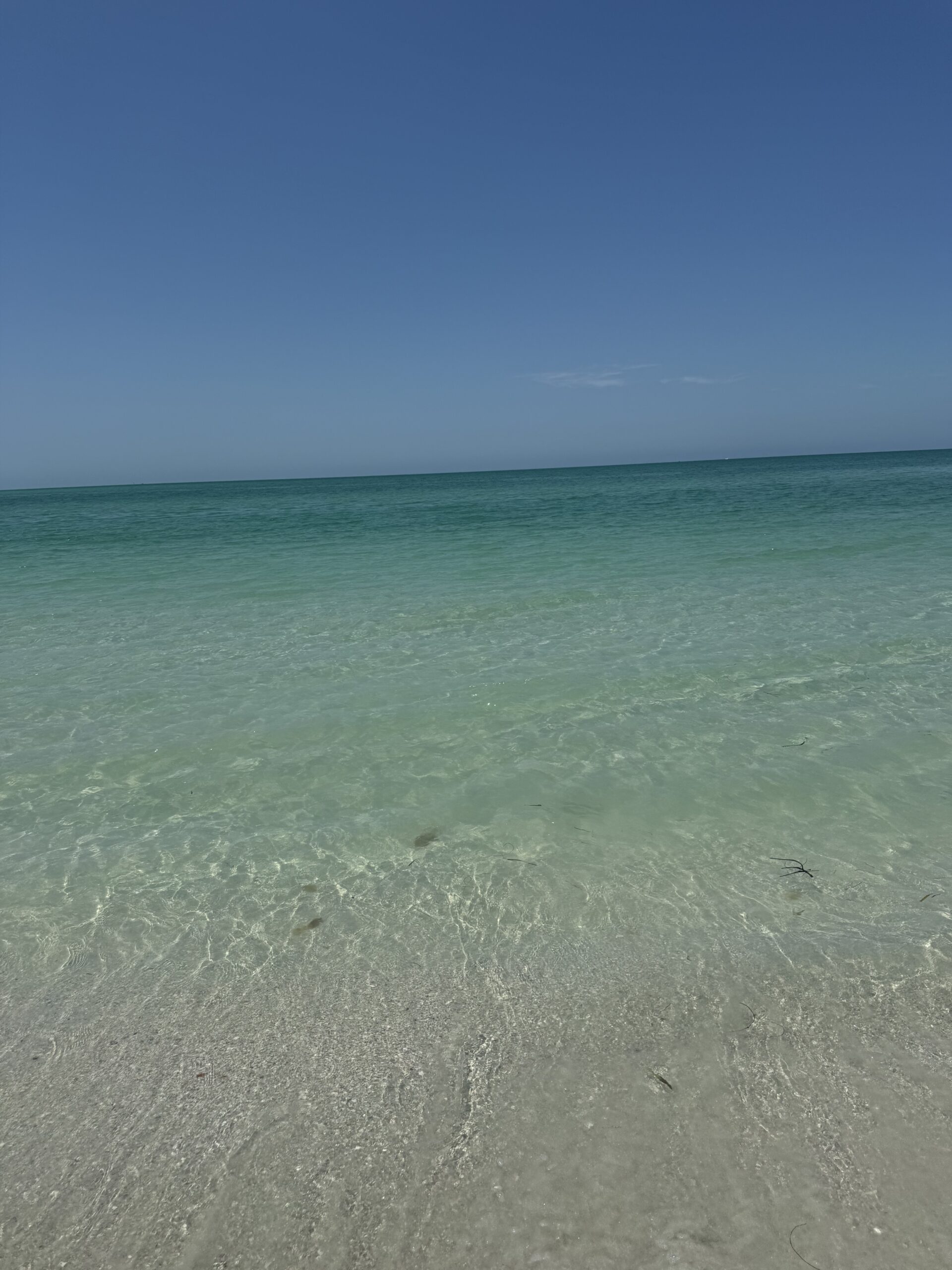 Clear turquoise water at Pass-A-Grille Beach
